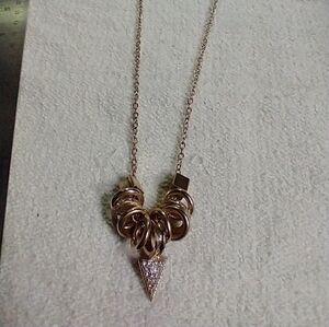 Long goldtone crystal arrowhead statement runway necklace